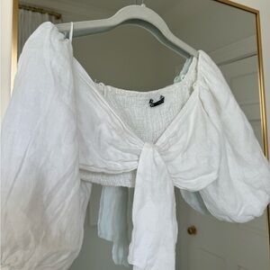 Zara White puffy sleeve crop top with tie in middle. Worn few times.